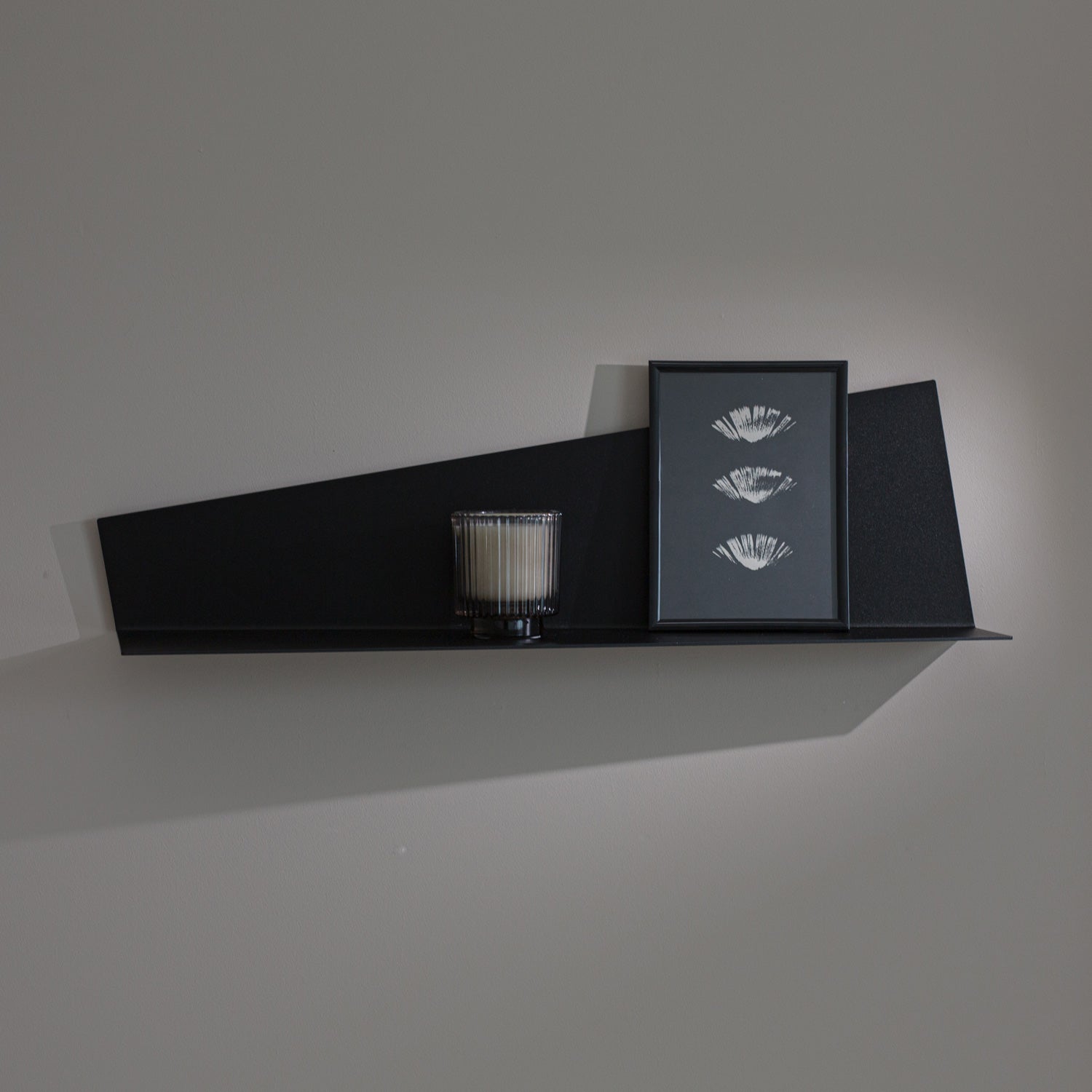 minimalist wall decorative shelf system in black on grey wall