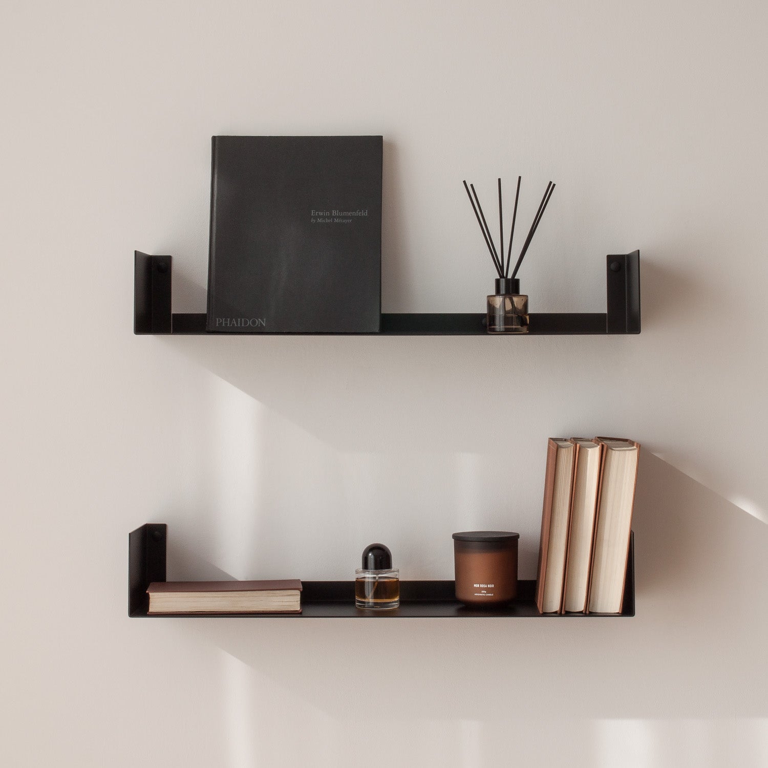 black floating metal shelves for books candle and decor