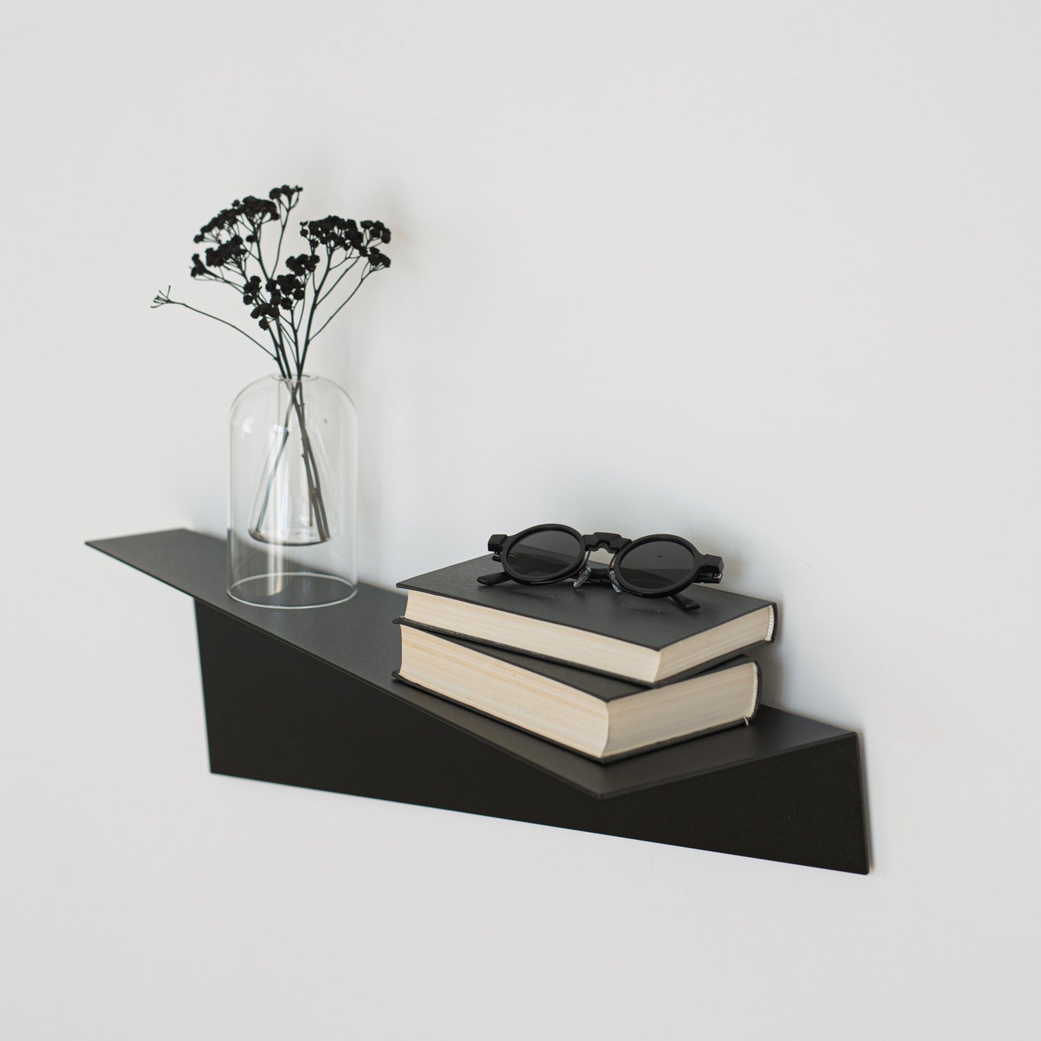 black decorative wall shelf geometric shape on white wall
