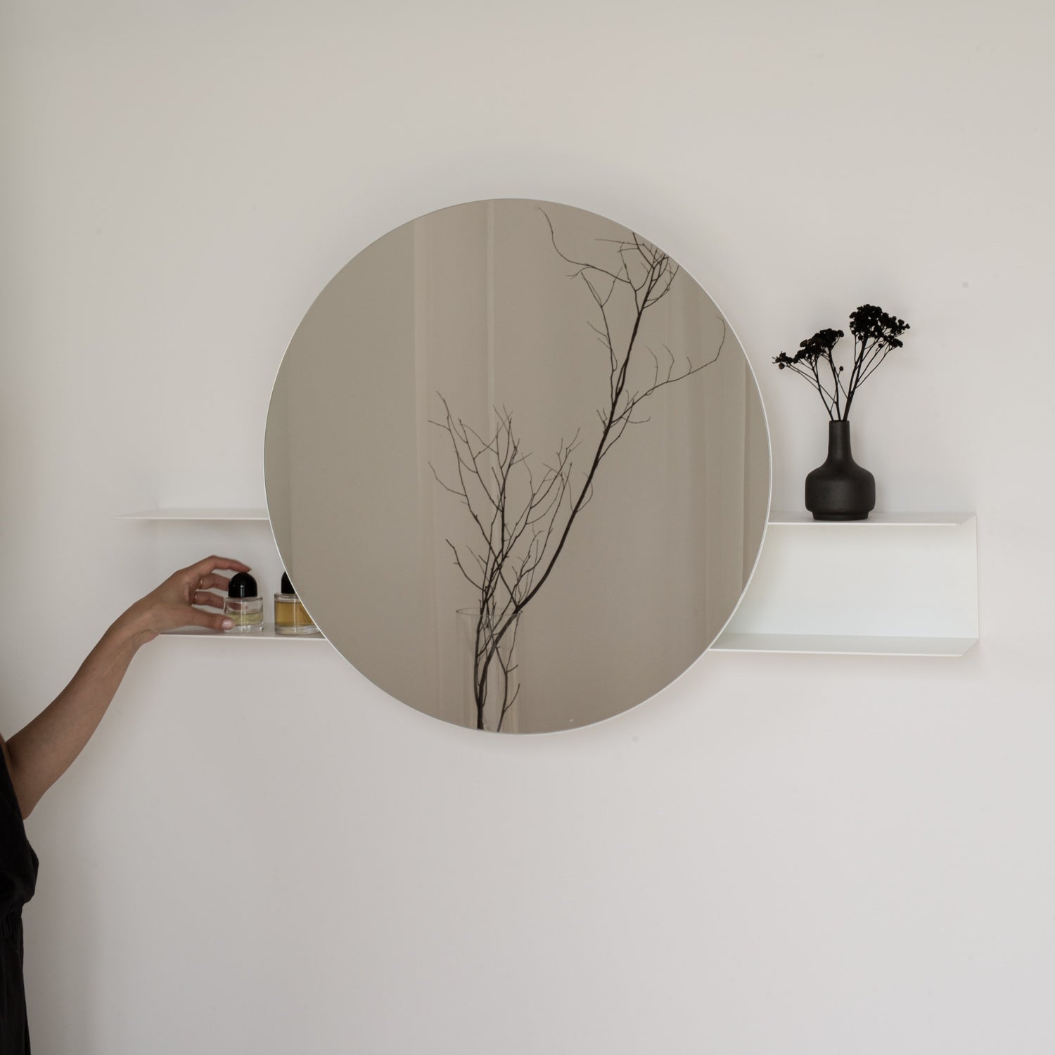 white large wall mounted mirror with a shelf on white wall