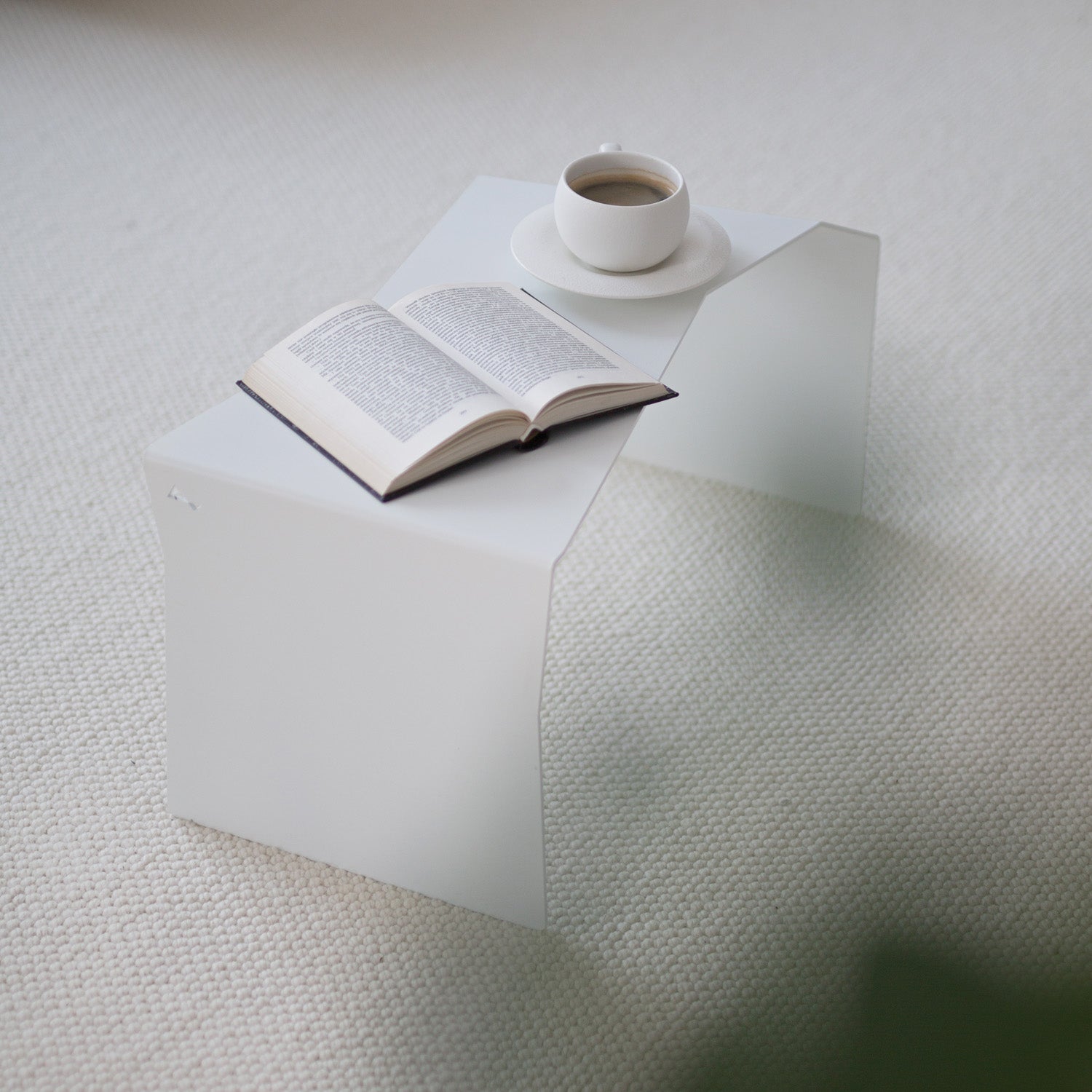 Modern white coffee and end table in horizontal view in modern interior