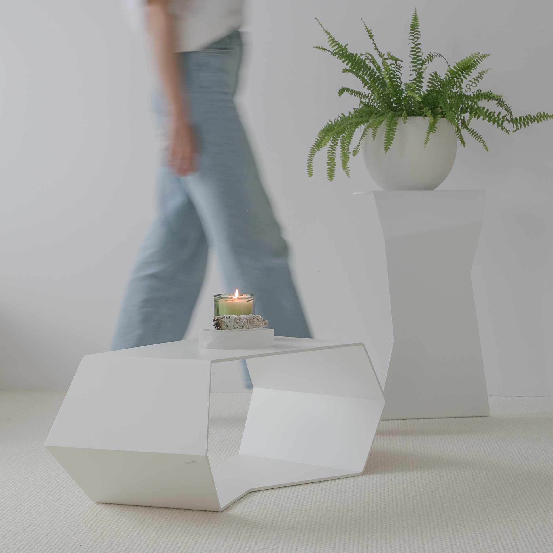 white metal coffee table with side table on the back in modern interior