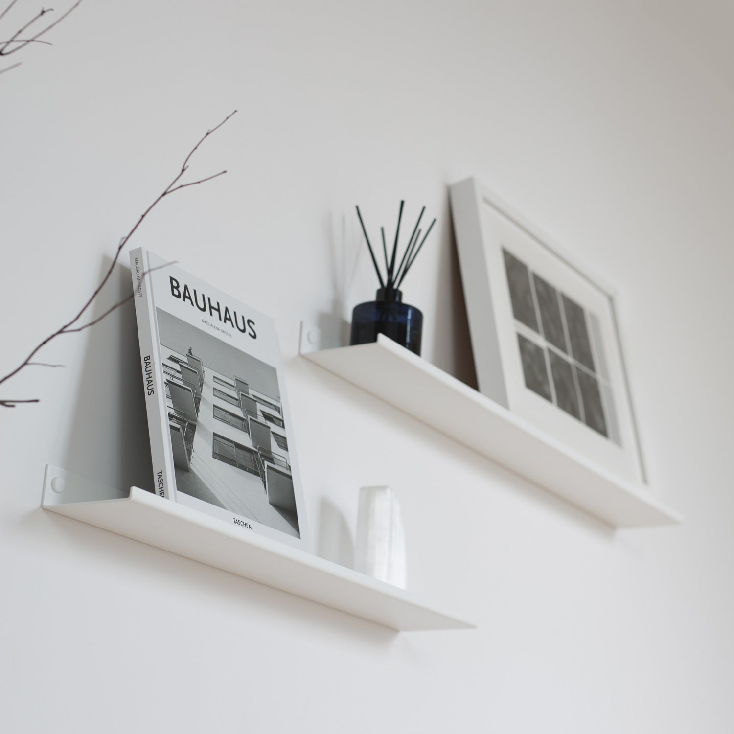 Two white modern display wall shelves angle view