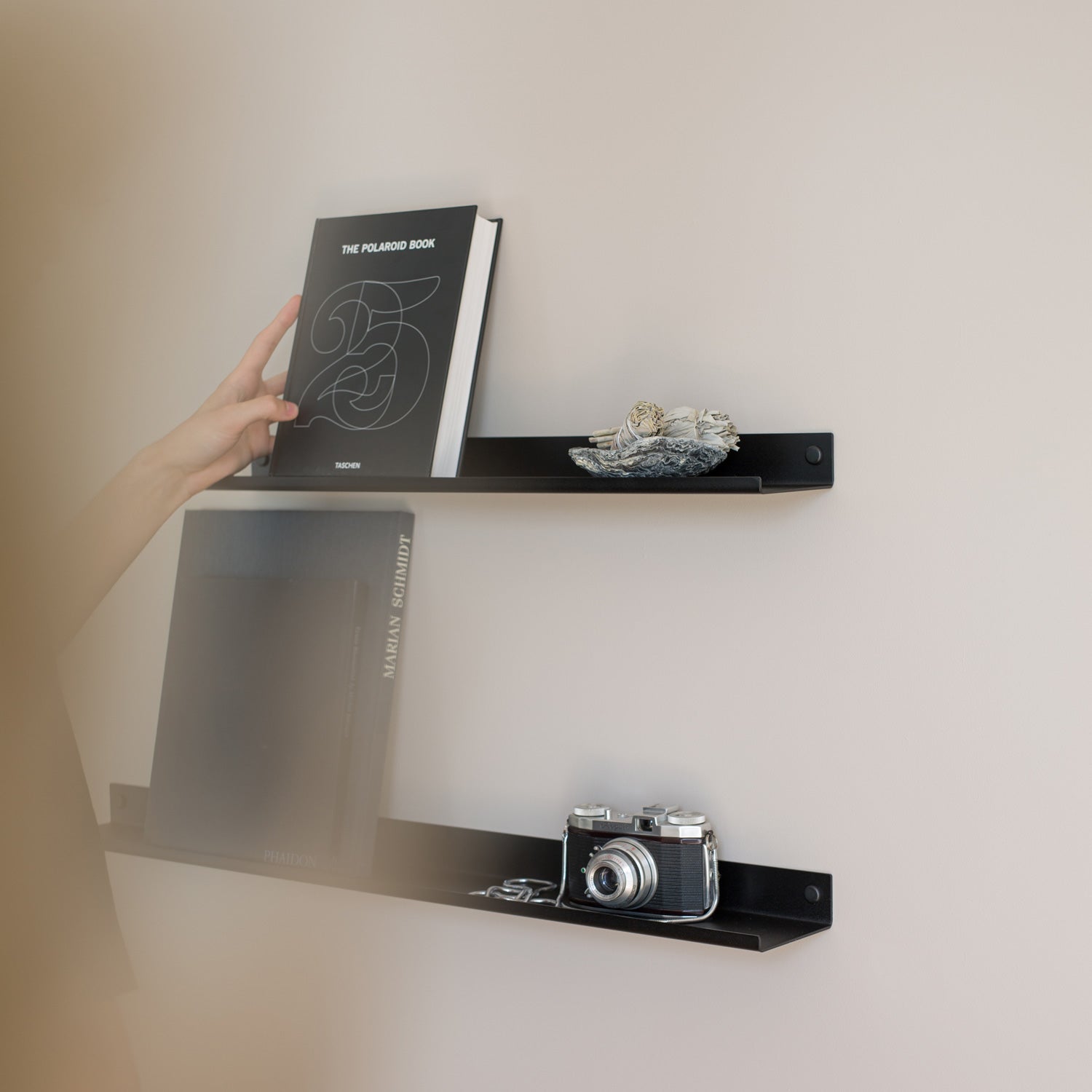 Black display wall shelf for holding picture frames