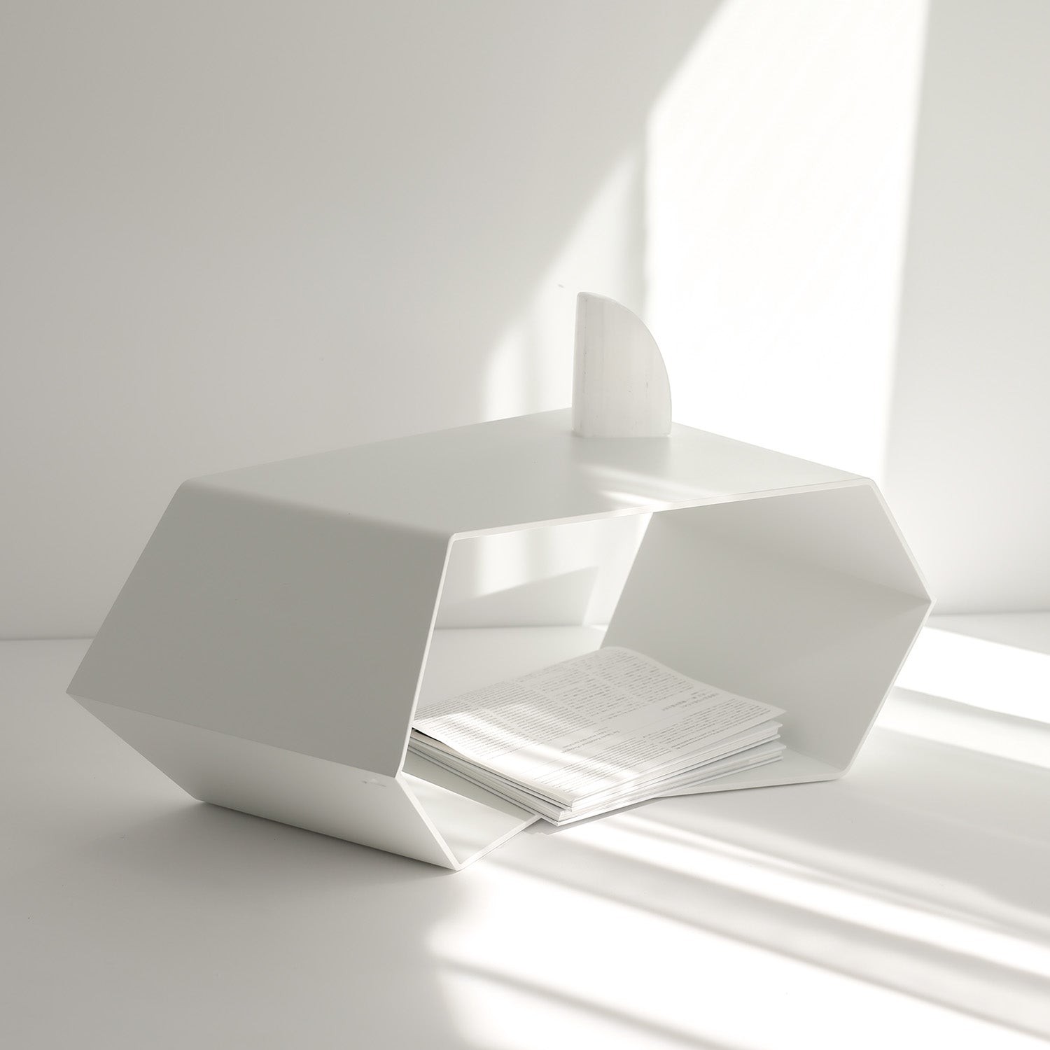 White small designer coffee table on white floor