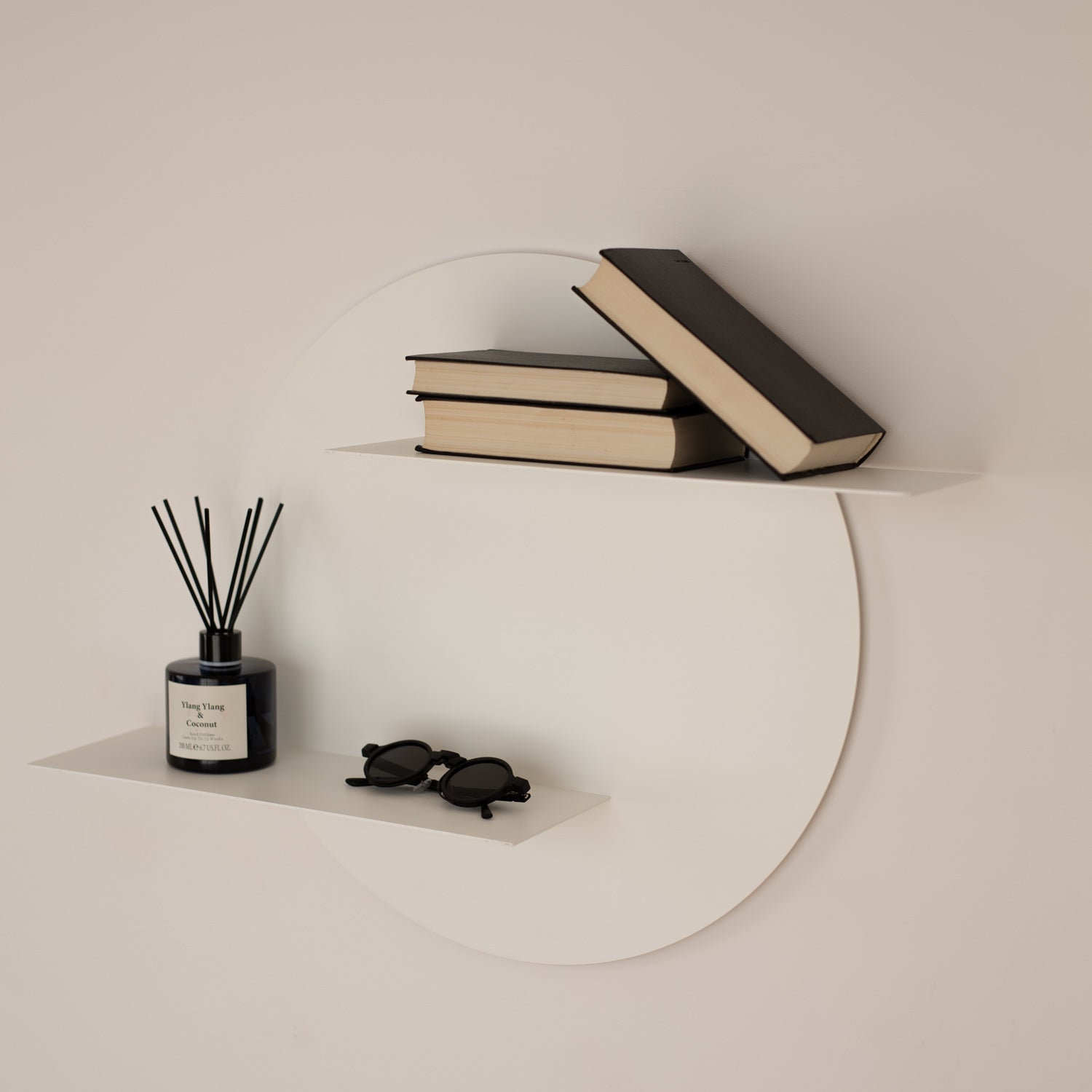 round decorative wall shelf system on white wall